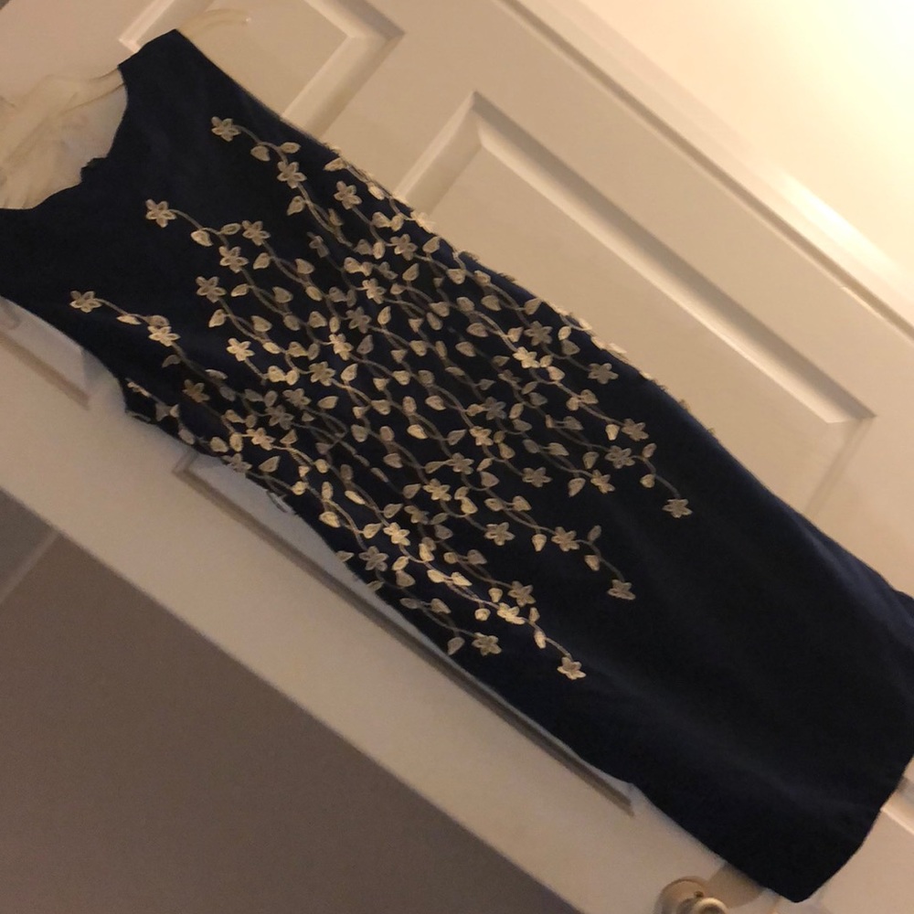 Brand NEW. Classy navy blue with flower details dress